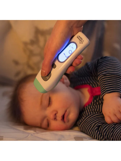 Photo showing an adult using the thermometer on a young sleeping child.