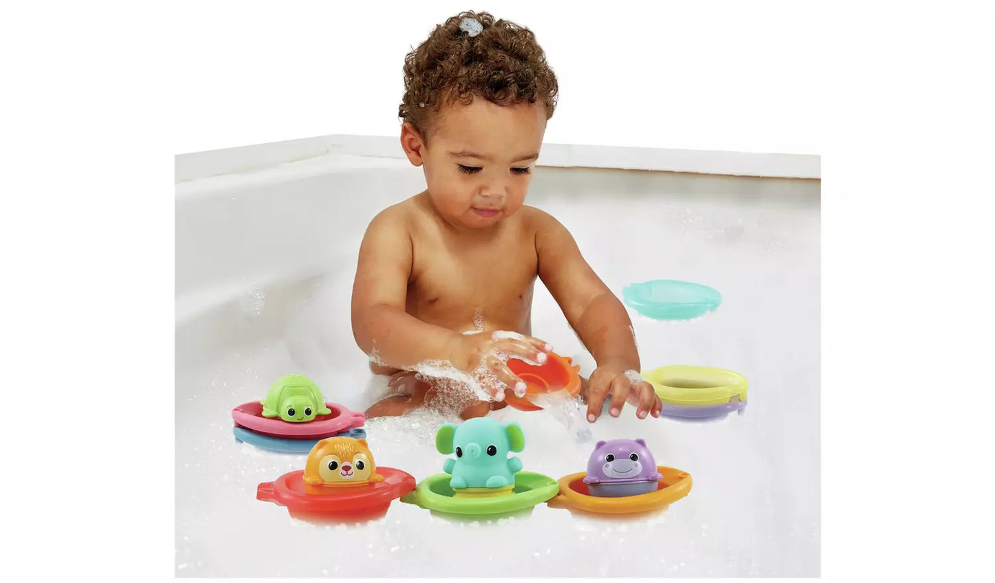 Photo of a child playing with the Vtech baby Stack & Splash Bathtime Boats in water.