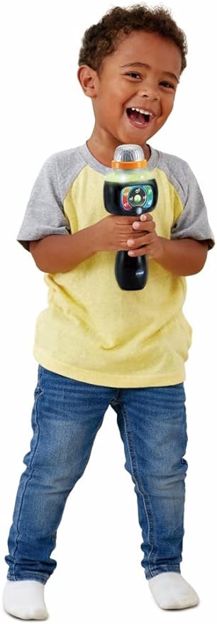 Young child playing with the Vtech Singing Sounds Microphone