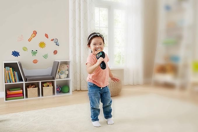 Young child playing with the Vtech Singing Sounds Microphone