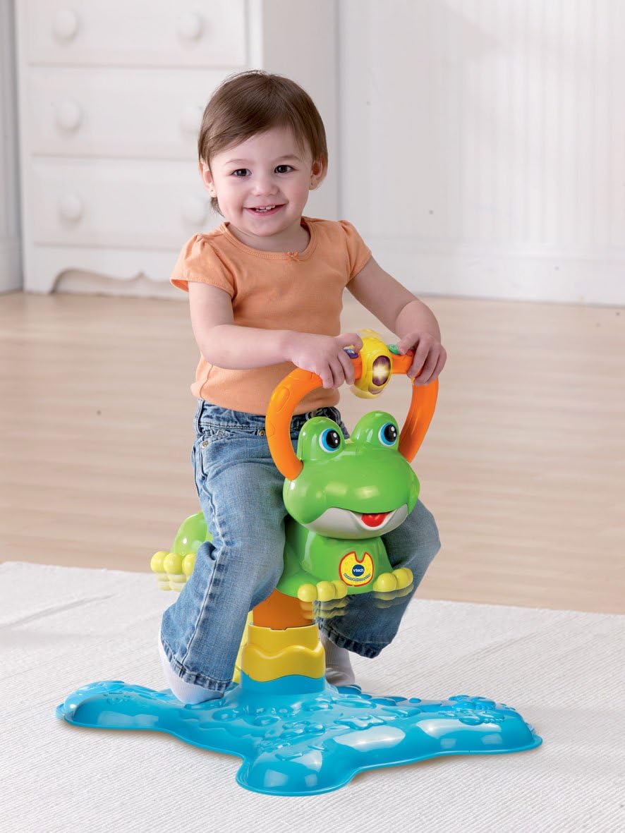 Photo showing a young child playing on the VTech Bounce and Discover Frog.