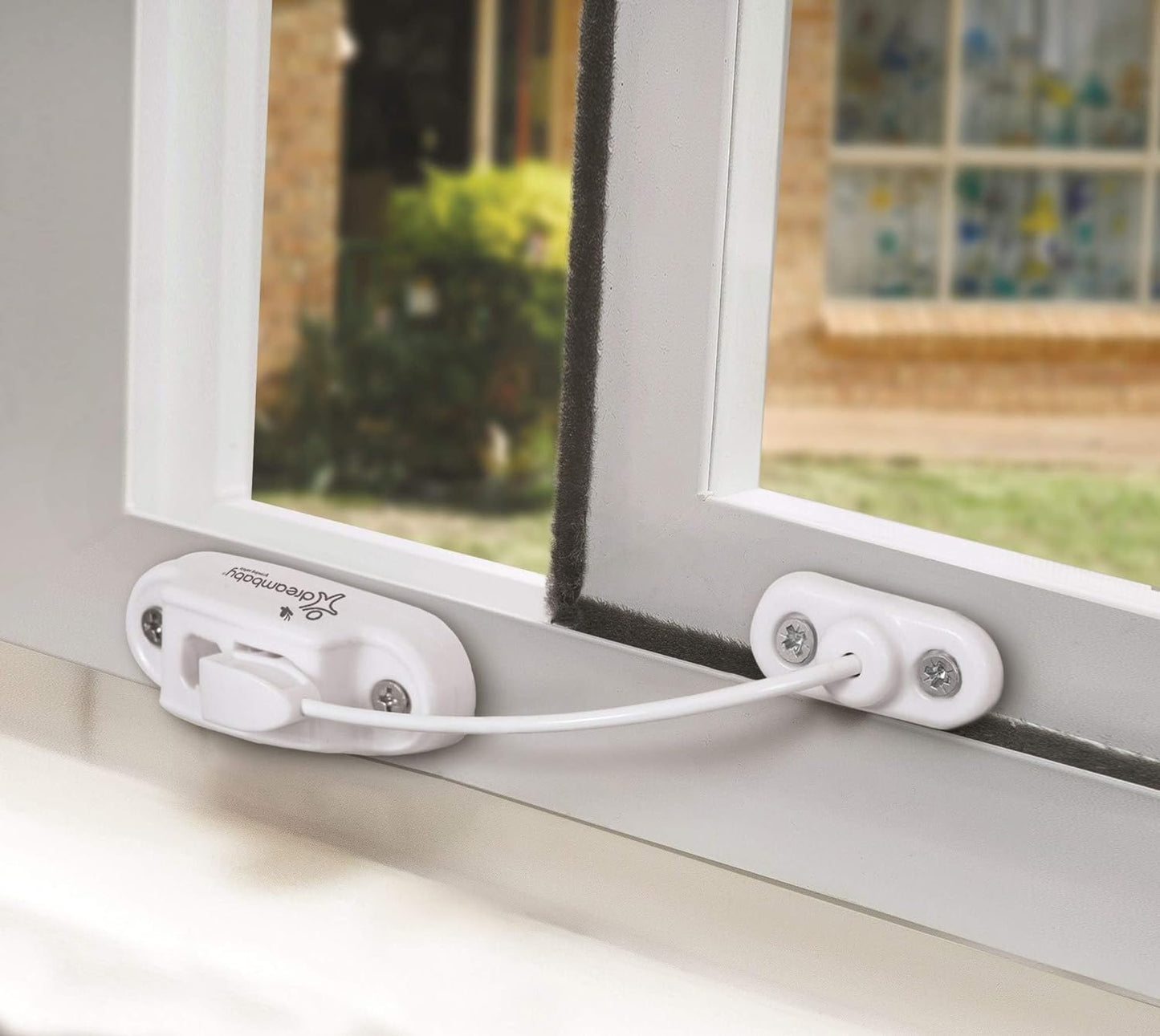 Photo of Dreambaby Breezz-lock Keyed Window Restrictor attached to a sliding window.