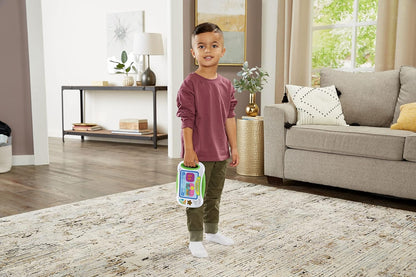 Young child holding the Leapfrog Slide to Read ABC Flash Cards