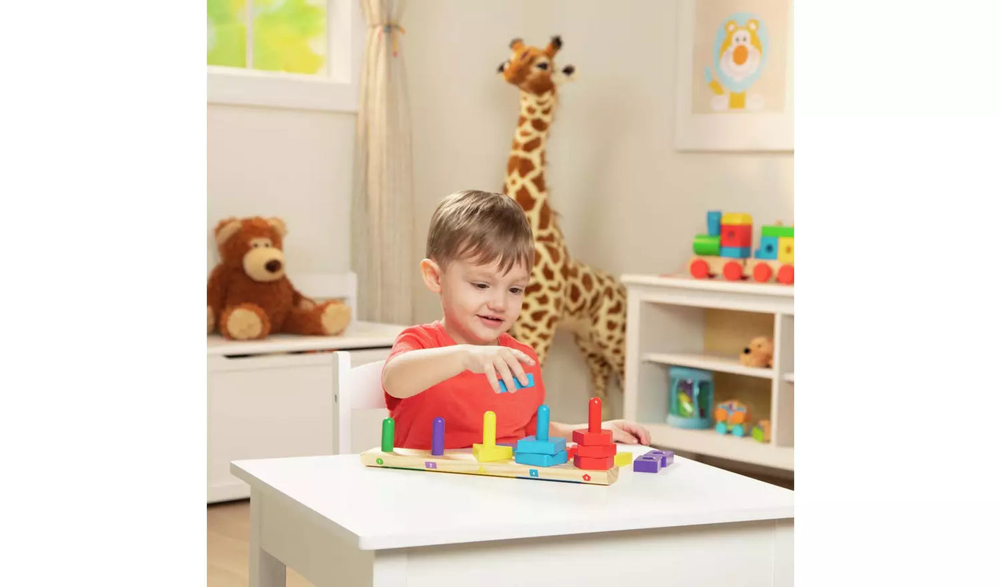 Young child playing with the Melissa & Doug Stack Sort Board Toy