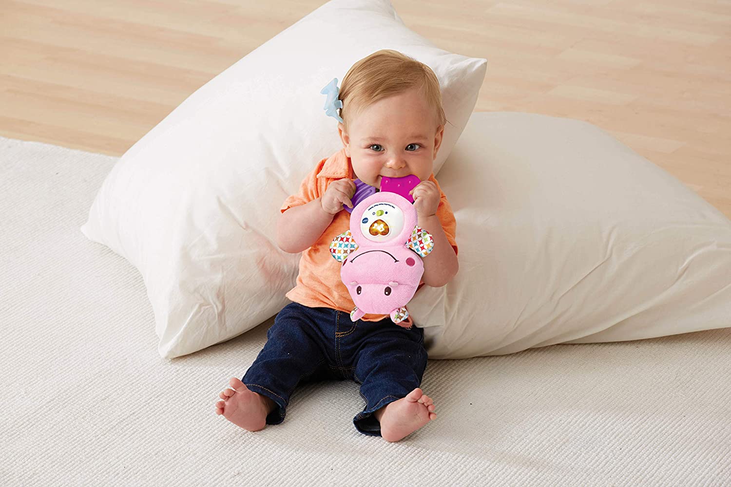 Young child playing with the Vtech Little Friendlies Happy Hippo Teether (Pink)