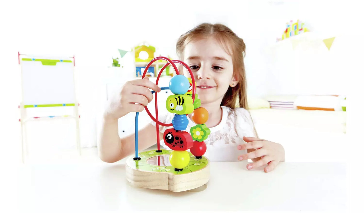 Stock photo of a young child playing with the animal shape hoop puzzle.