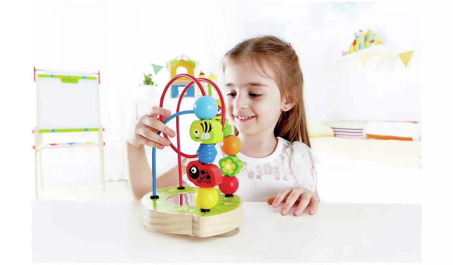 Stock photo of a young child playing with the animal shape hoop puzzle.