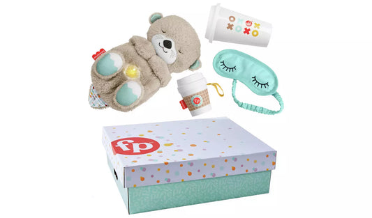 Stock photo showing the contents: A gift box containing a plush otter soother, coffee cup rattle teether for baby and a soft eye mask and ceramic beverage mug for grownups.