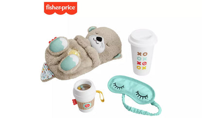 Stock photo of box contents: a plush otter soother, coffee cup rattle teether for baby and a soft eye mask and ceramic beverage mug for grownups.