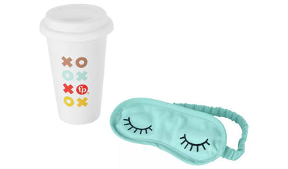 Stock photo of the ceramic coffee cup and soft eye mask from the front.